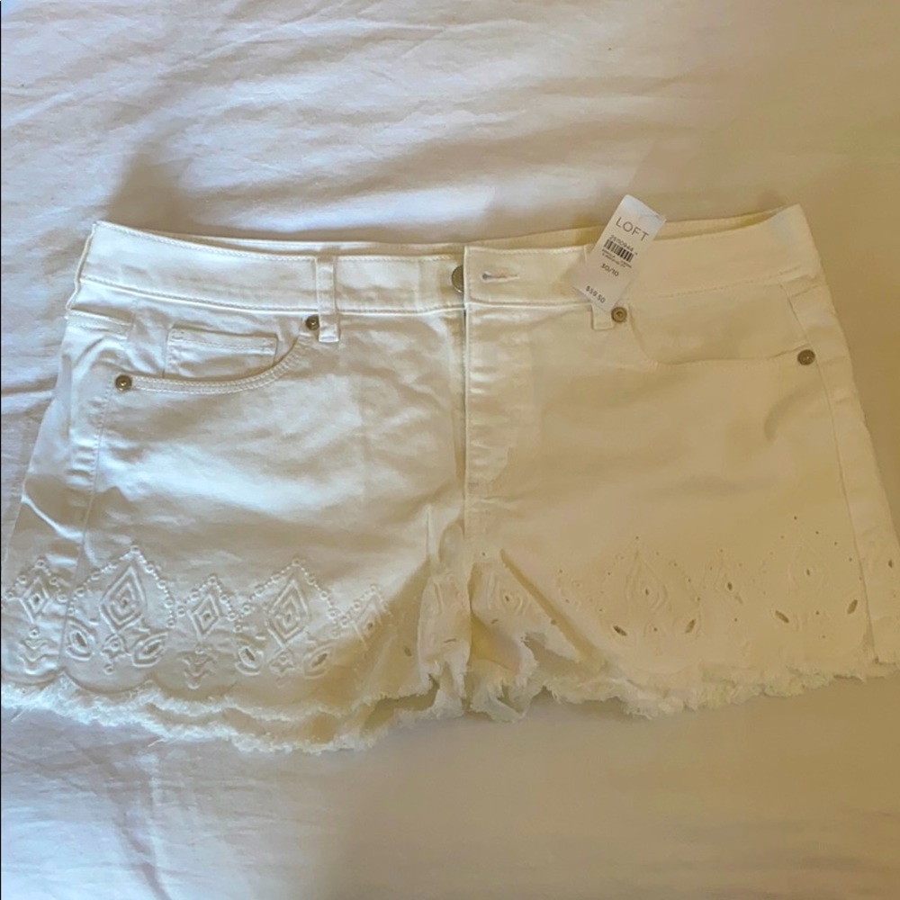 With tags denim shorts
